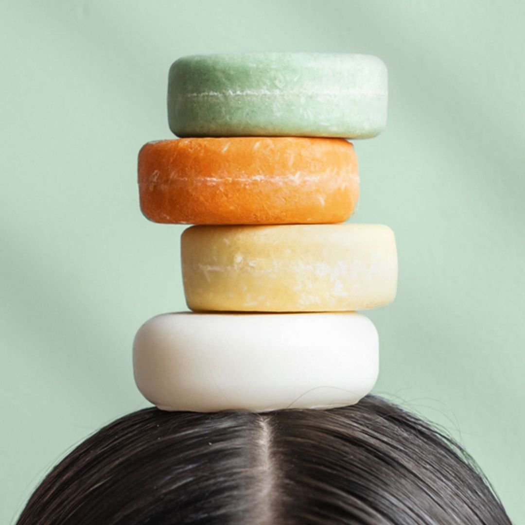 Peppermint & Chamomile Shampoo Bar Stacked on a head.